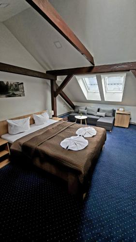 מיטה או מיטות בחדר ב-Hotel Džbán