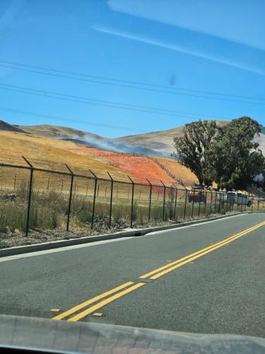 an empty road with a fence on the side of the road at Gateway to Napa in Fairfield