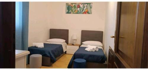 a room with two beds in a room at Nerissa apartments in Terrasini