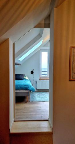 a bedroom with a bed and a window in a room at A La Bruyère in Saint-Martin-du-Lac