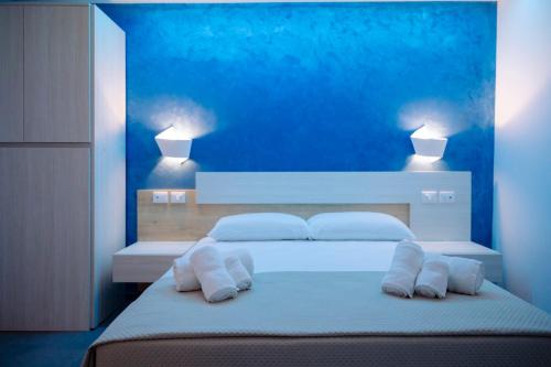 a bedroom with a large white bed with two pillows at Orizzonte Blu in Villa San Giovanni