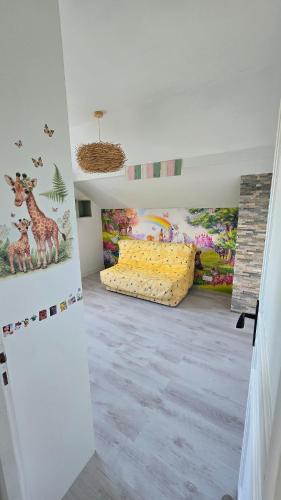 a room with animals painted on the walls at Maison de village in Copponex