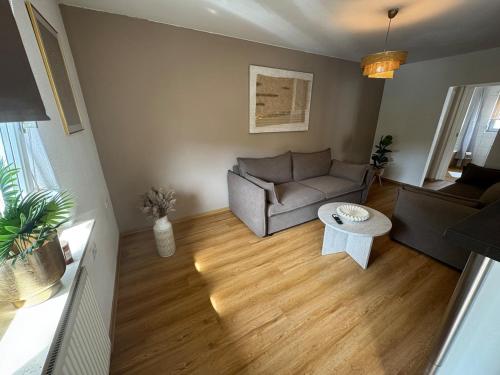 a living room with a couch and a table at BOHO Apartment Skye in Bad Reichenhall