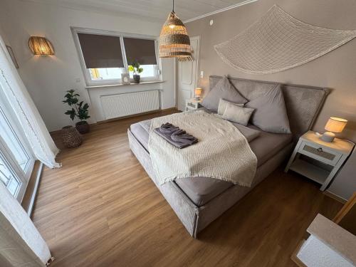 a bedroom with a bed and a couch at BOHO Apartment Skye in Bad Reichenhall