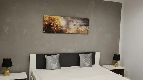 a bedroom with a bed and two night stands at Feriendomizil Sasse in Wusterwitz