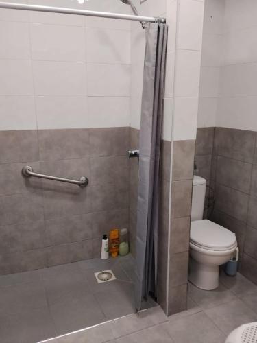 a bathroom with a shower with a toilet at Gure Bidetxe in San Andrés