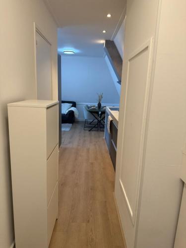 a hallway leading to a room with a kitchen at IL Mulino House D, keukenhof in Hillegom