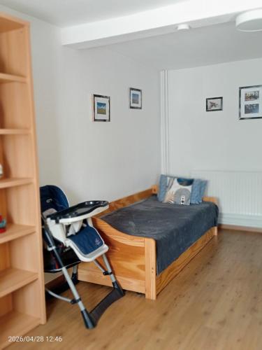 a bedroom with a bed and a chair at Ferienhaus Medebach in Medebach