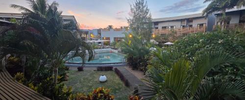 an aerial view of a resort with a swimming pool at Cosy Holidays in Trou aux Biches