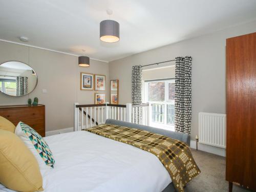 a bedroom with a bed and a window at Little Pentwyn in Hereford