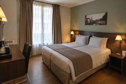a hotel room with a large bed and a window at Casa Velvet in Madrid