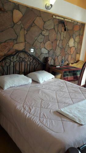 Säng eller sängar i ett rum på Marlin Guest Resort