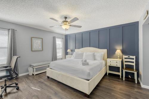 a bedroom with a bed and a ceiling fan at Relaxed Poolside Gym Escape in Green Cove Springs