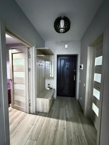 a large bathroom with a tub and a mirror at Apartment Versailles Park 1 in Irpin