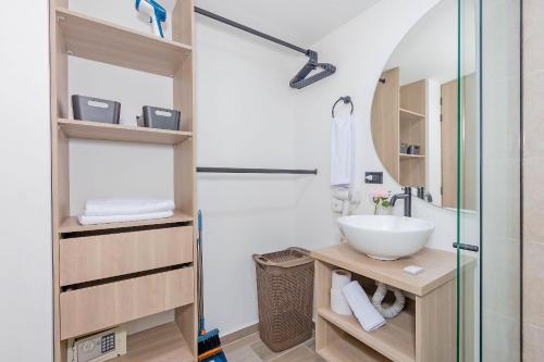 a bathroom with a sink and a shower at Bit Building in Medellín