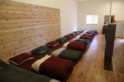 a row of bean bags lined up in a room at Romeo B&B in Taitung City