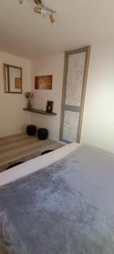 a bedroom with a bed and a window at Verrecheznous-lepuy in Le Puy-Notre-Dame