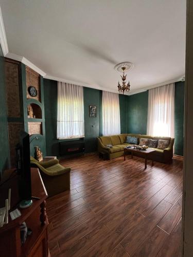 a living room with a couch and a table at Rest house Keda in K'eda