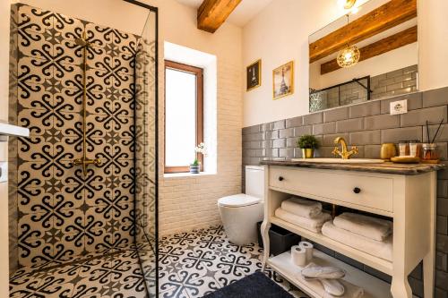 a bathroom with a shower and a sink at Dallure House Boutique Brasov in Braşov