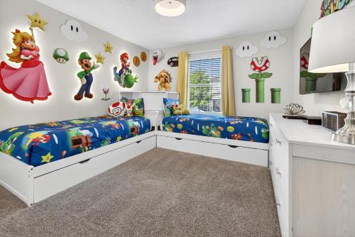 a childs room with two beds and a kitchen at 1556 PD - Poolside Bliss: Enchanted 4BR Townhome in Davenport