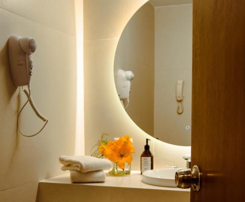 a bathroom with a sink and a mirror at Regente Palace Hotel in Buenos Aires