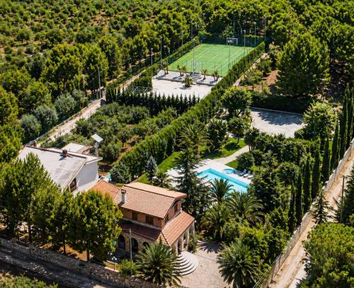 an aerial view of a house with a pool and trees at Villa Adriana - Private Pool Villa in Puglia in Andria