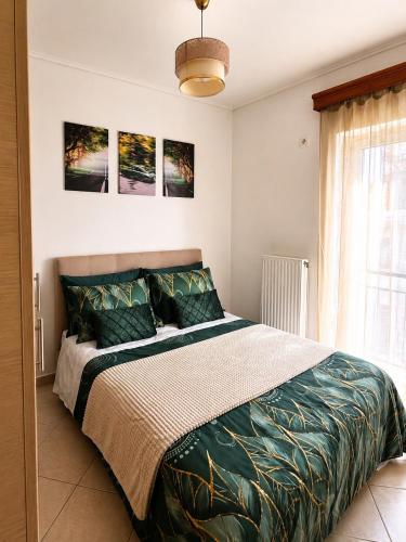 a bedroom with a large bed in a room at H&H cozy retreat ,Fireplace and Parking in Piraeus