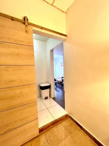 a room with a door leading into a room with a hallway at Dushi Apartments in Willemstad