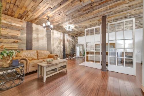 a living room with a couch and a table at Peaceful Studio & Work Friendly Walk to Hyde Park in Tampa