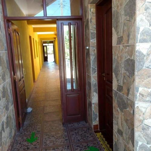 a hallway of a house with a door at Misky Sonqo in Tilcara