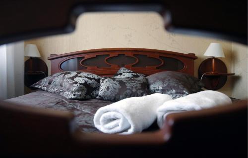 Postel nebo postele na pokoji v ubytování Hotel Plock