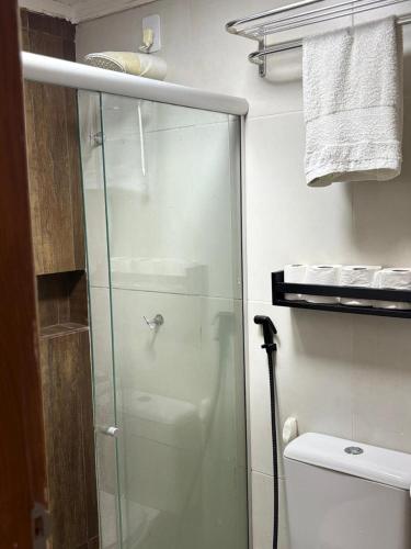 a glass shower in a bathroom with a toilet at Apartamento com 02 quartos in Maceió
