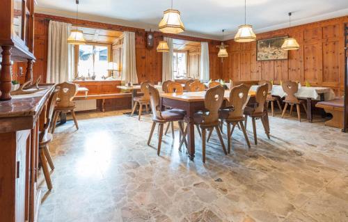 a large dining room with a table and chairs at Sterzinger Posthotel in Nassereith