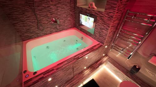 an overhead view of a bathroom with a tub at Azura Suites in Bradford