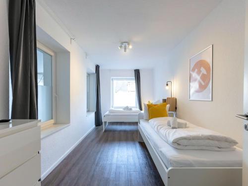a living room with a couch and a window at BudgetRoom 3 BR perfect for Teams in Castrop-Rauxel
