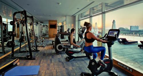 a group of women riding on bikes in a gym at Novotel Pune Viman Nagar Road in Pune
