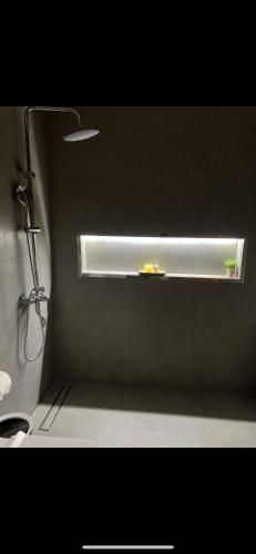 a window in a bathroom with a shower and a sink at Mykonos Resort in Abu Dhabi
