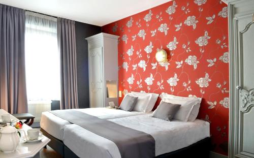 Katil atau katil-katil dalam bilik di Best Western Hôtel Montgomery