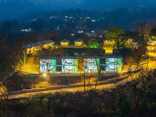 a house lit up at night with lights at Nature Trails Durshet, Khopoli in Khopoli