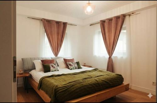 a bedroom with a large bed with curtains at Refugiul Apusenilor in Scărişoara