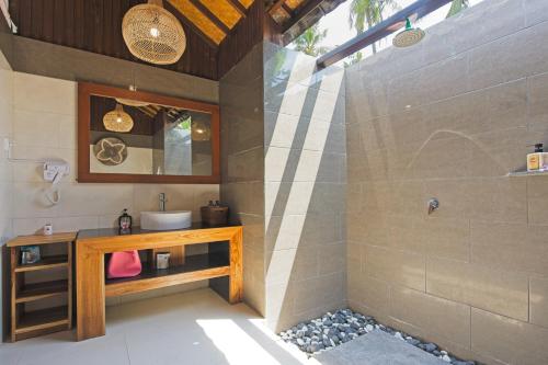 a bathroom with a sink and a shower at Gili Air Bungalows in Gili Islands