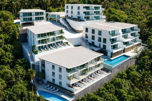 an aerial view of the resort buildings at Kata Hills Condo with Terrace & Sea View O910 in Ka Rorn