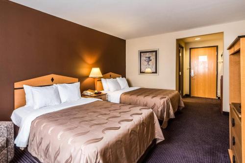 a hotel room with two beds and a television at Quality Inn Killeen Near Fort Hood in Killeen