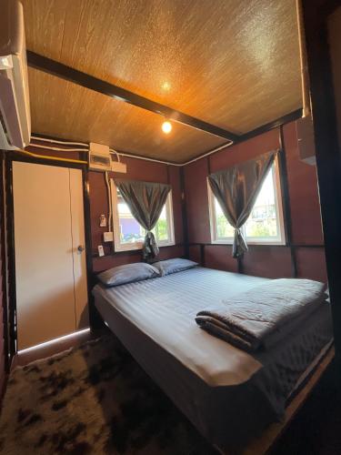 a bedroom with a bed in an rv at Lamai Home 2 in Ko Yao Noi