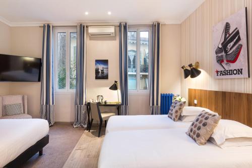 Postel nebo postele na pokoji v ubytování Best Western Plus Hôtel Brice Garden Nice