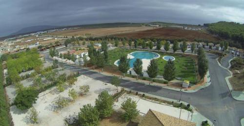 an aerial view of a resort with a swimming pool at Camping la Sierrecilla in Humilladero