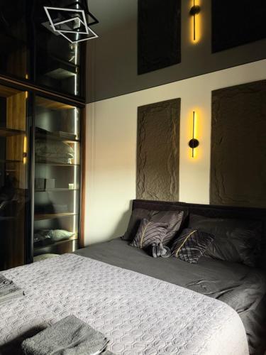 a bedroom with a large bed and a closet at Nanna apartman in Ruma