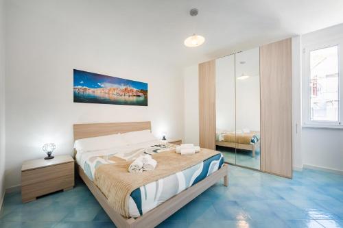 a bedroom with a large bed in a room at La casa del Pescatore in Procida