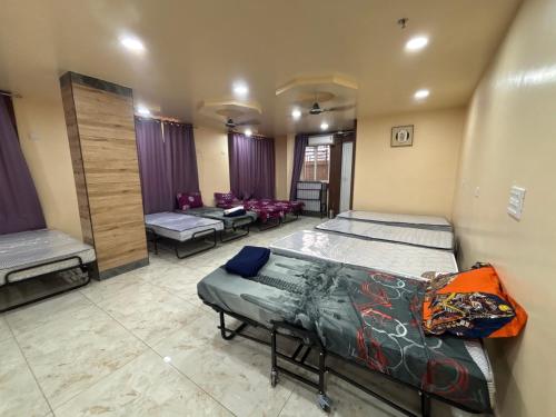 a room with two beds at S K Tower Hotels in Nawāda