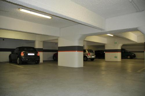 a parking garage with cars parked in it at Privilège Hôtel & Apparts Eurociel Centre Comédie in Montpellier